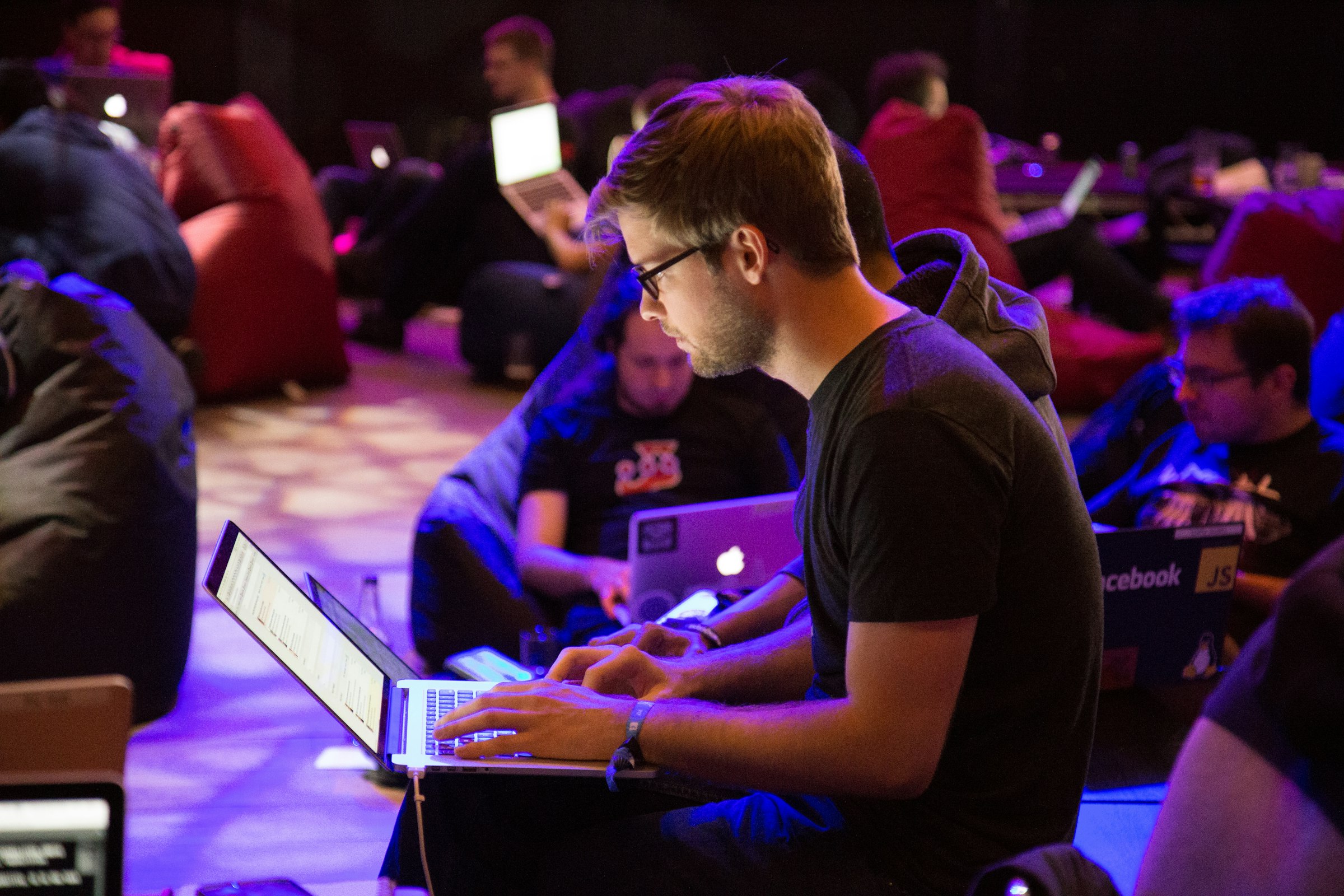 Person coding on a laptop in a development setting